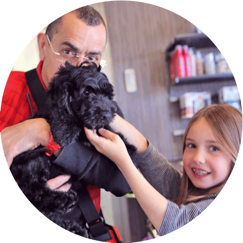 father and daughter with small dog, round picture